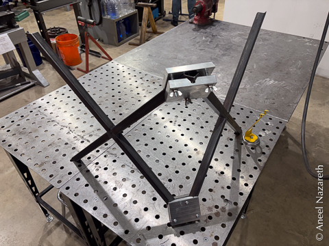 Two of the X shapes held together in the custom jigs